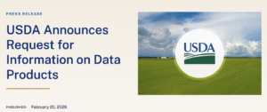Press release graphic with the headline “USDA Announces Request for Information on Data Products.” Published date reads February 20, 2026. On the right, the USDA logo appears centered in a white circle over a green farm field under a cloudy blue sky.